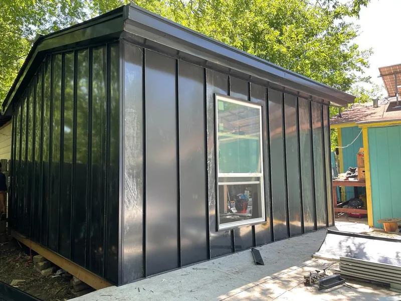 Black standing seam metal wall panels for Roof Inspection in Worth